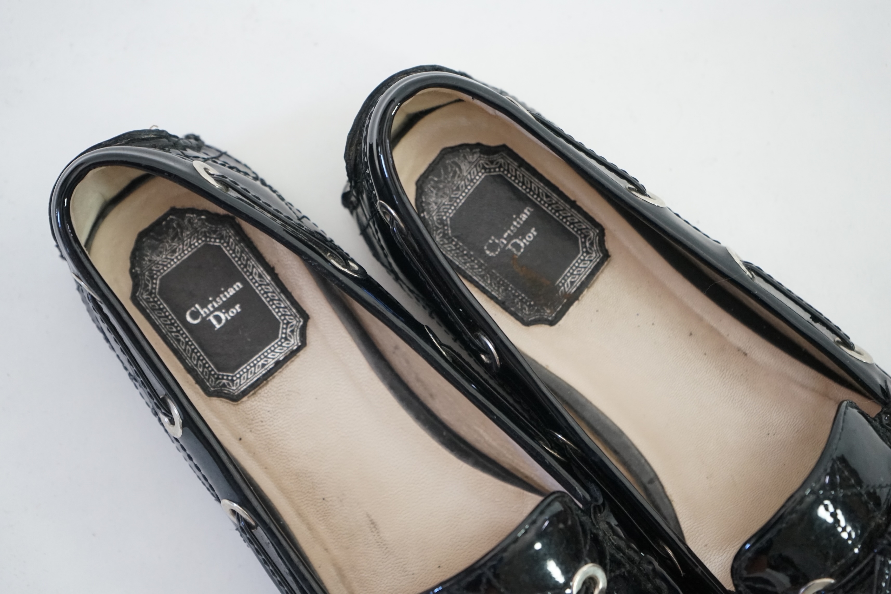 A pair of Christian Dior black patient leather lady's driving shoes with dustbag and in original box. Size 38.5. Proceeds to Happy Paws Puppy Rescue